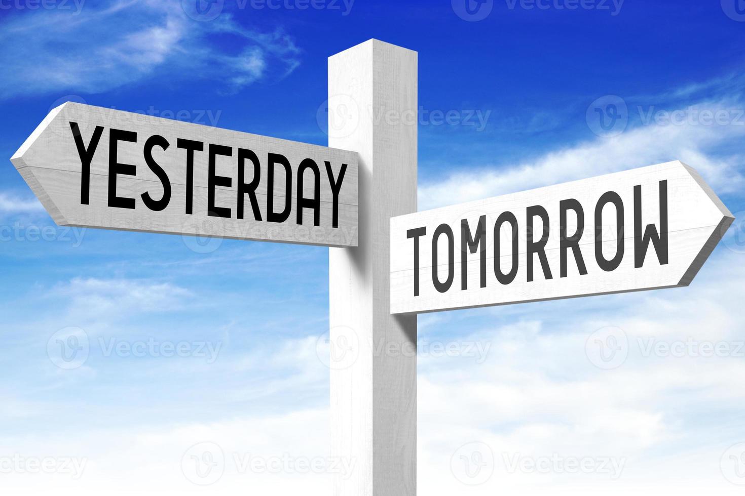 Tomorrow, Yesterday - Wooden Signpost with Two Arrows and Sky in Background photo