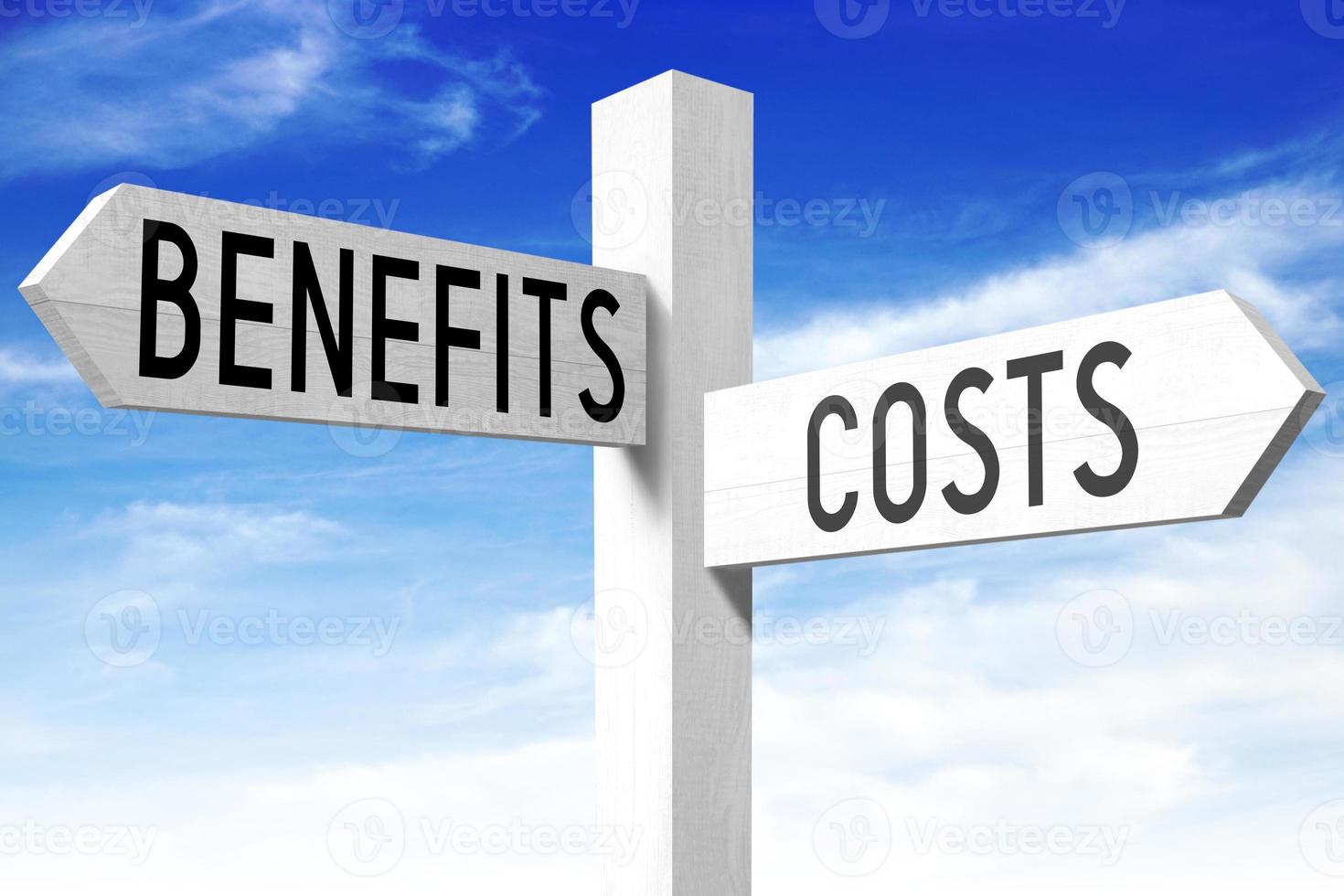 Costs, Benefits - Wooden Signpost with Two Arrows and Sky in Background photo
