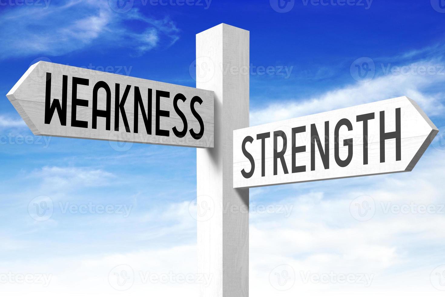 Weakness, Strength - Wooden Signpost with Two Arrows and Sky in Background photo