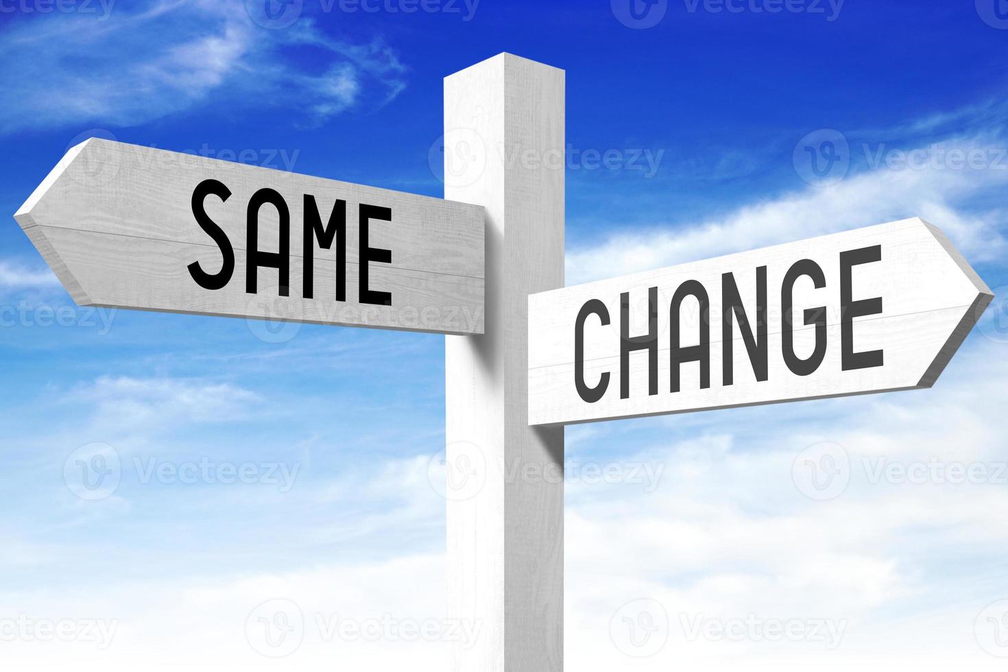 Same, Change - Wooden Signpost with Two Arrows and Sky in Background photo