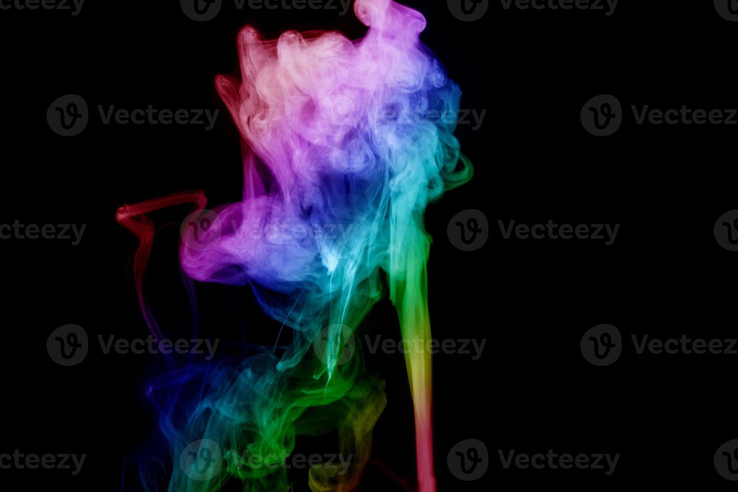 Abstract smoke isolated on black background,Rainbow powder photo