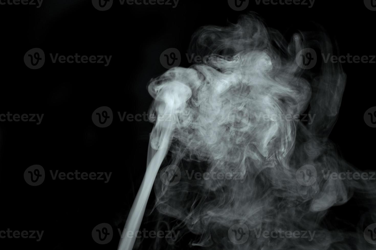 Abstract  powder or smoke isolated on black background photo