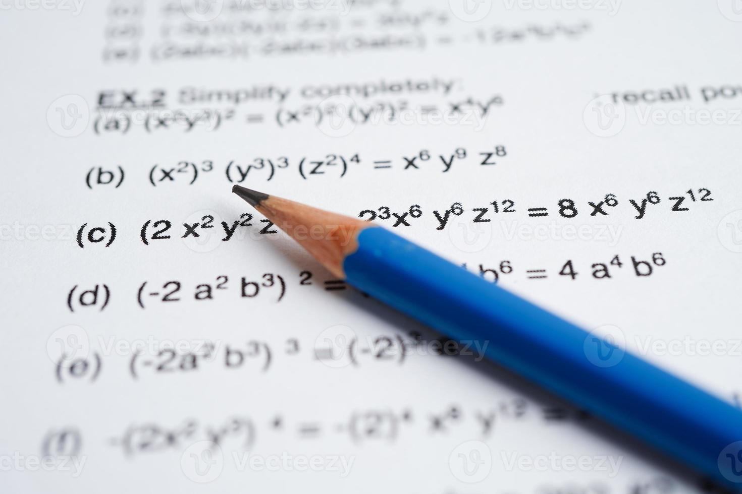 Pencil on mathematic formula exercise test paper in education school. photo