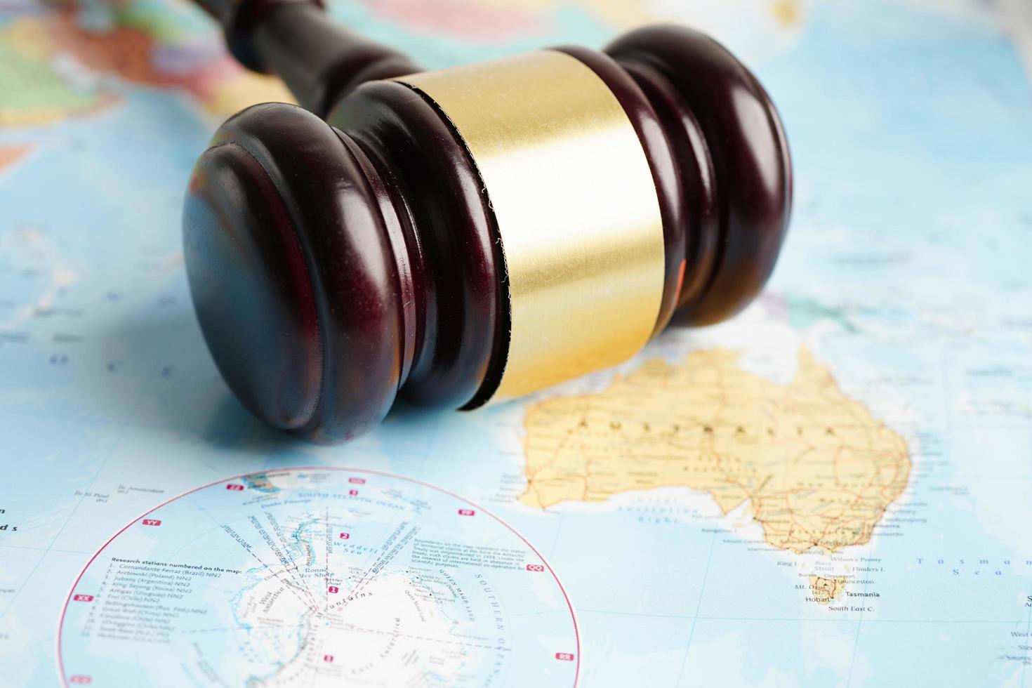Bangkok, Thailand - May 15, 2022 Judges gavel on world map. photo