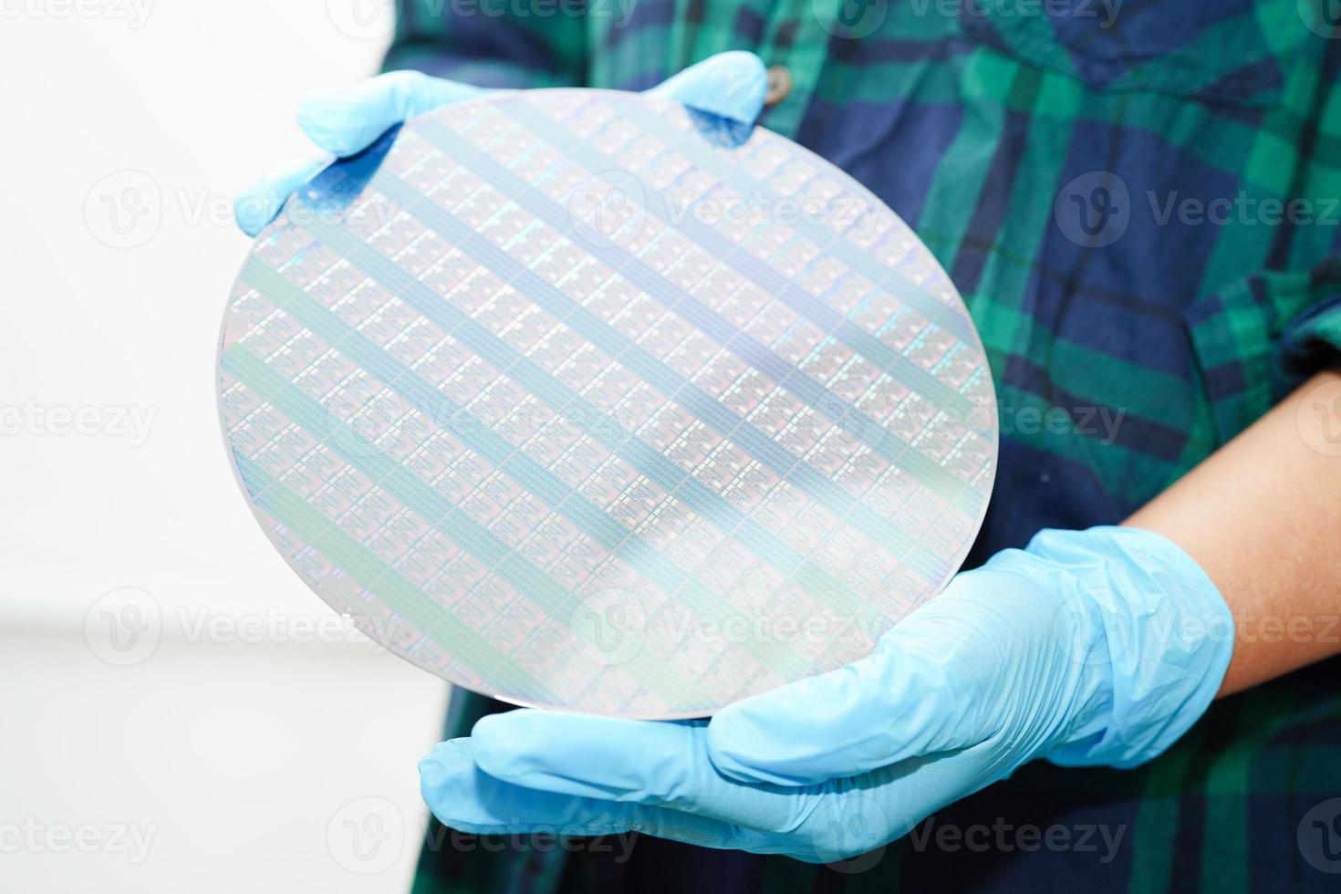 Silicon wafer for manufacturing semiconductor of integrated circuit. photo