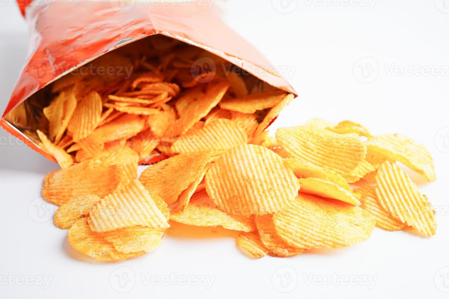 Potato chips in open bag, delicious BBQ seasoning spicy for crips, thin slice deep fried snack fast food. photo