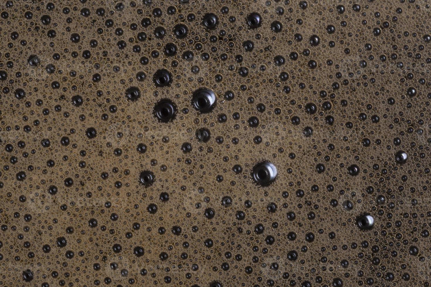 close up of coffee foam bubbles photo