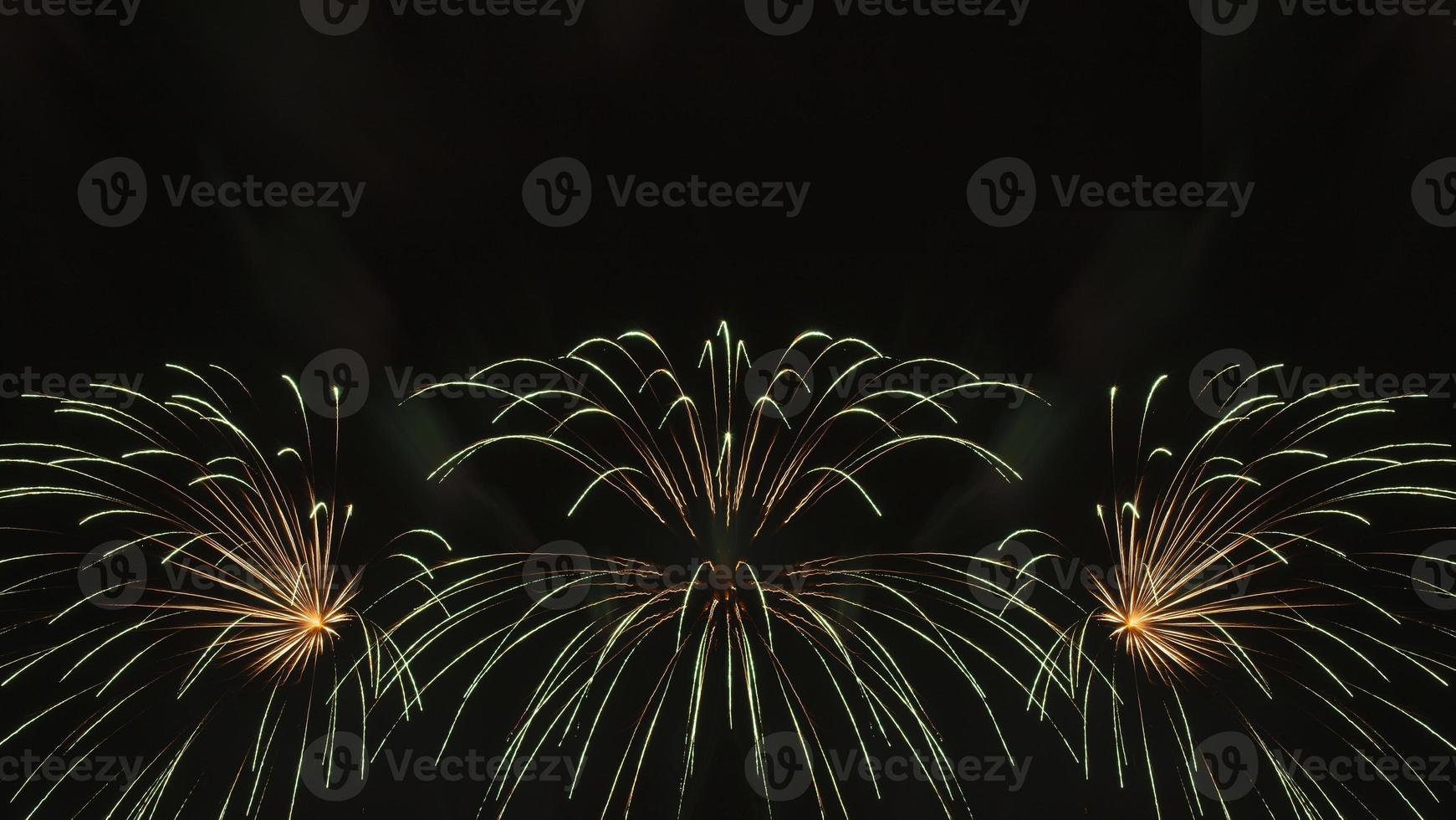 holiday background, green fireworks in night sky photo