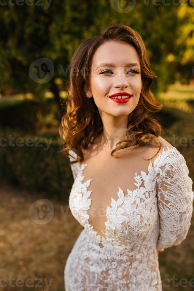 The beautiful bride smiling outdoors photo
