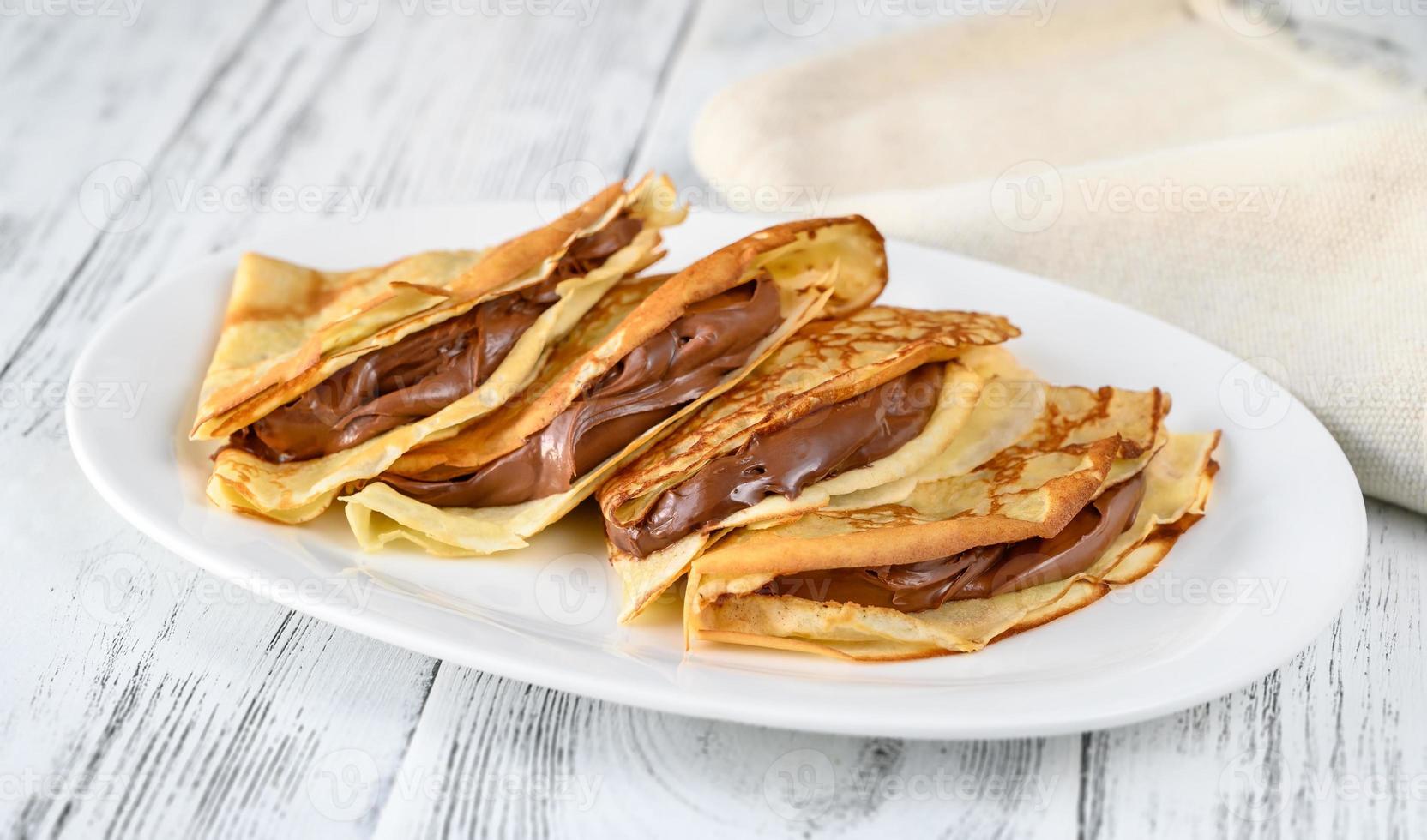 Crepes with chocolate cream photo