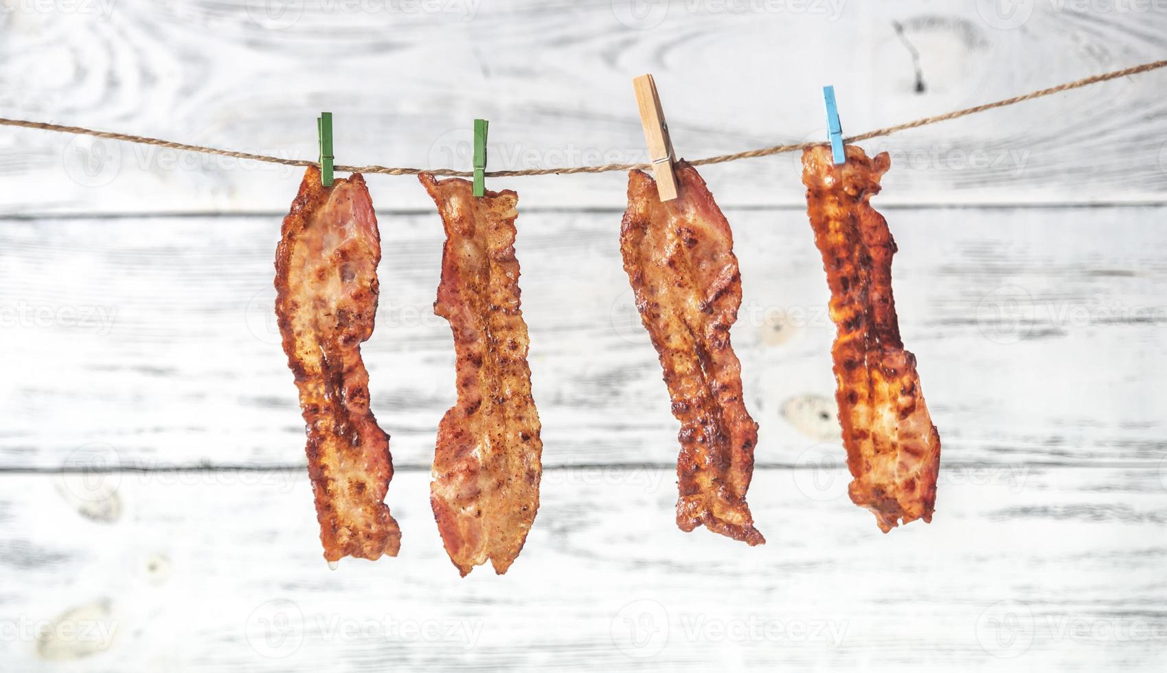 Slices of fried bacon photo