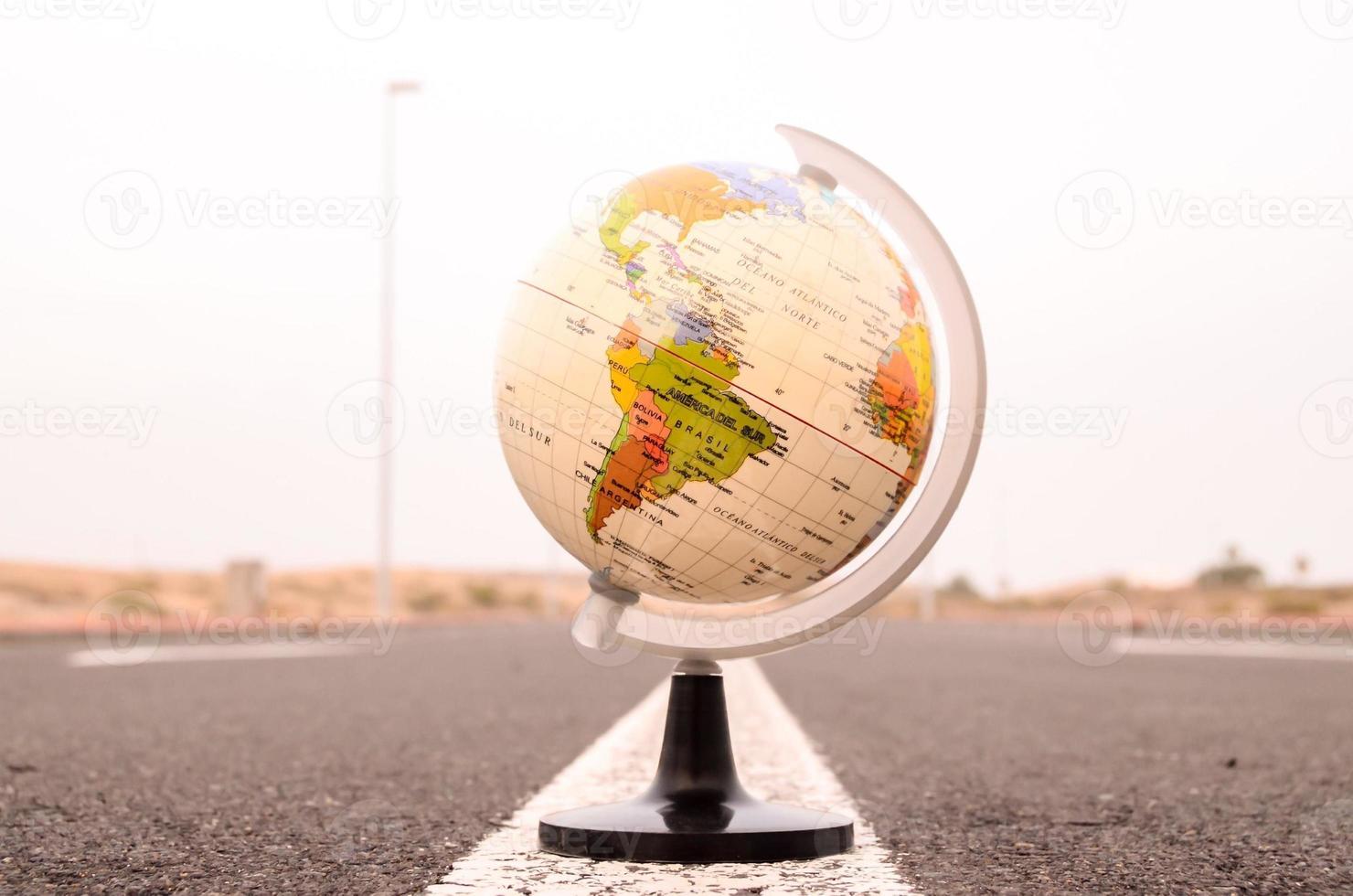 Globe on the road photo