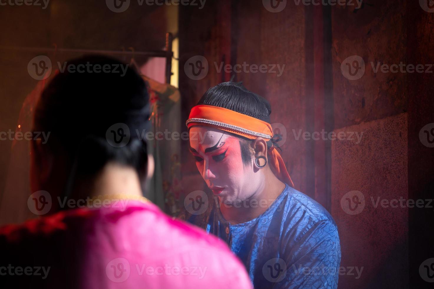 Male and female Chinese opera actors, Sit and make up to be the typical color of the show as the protagonist. photo