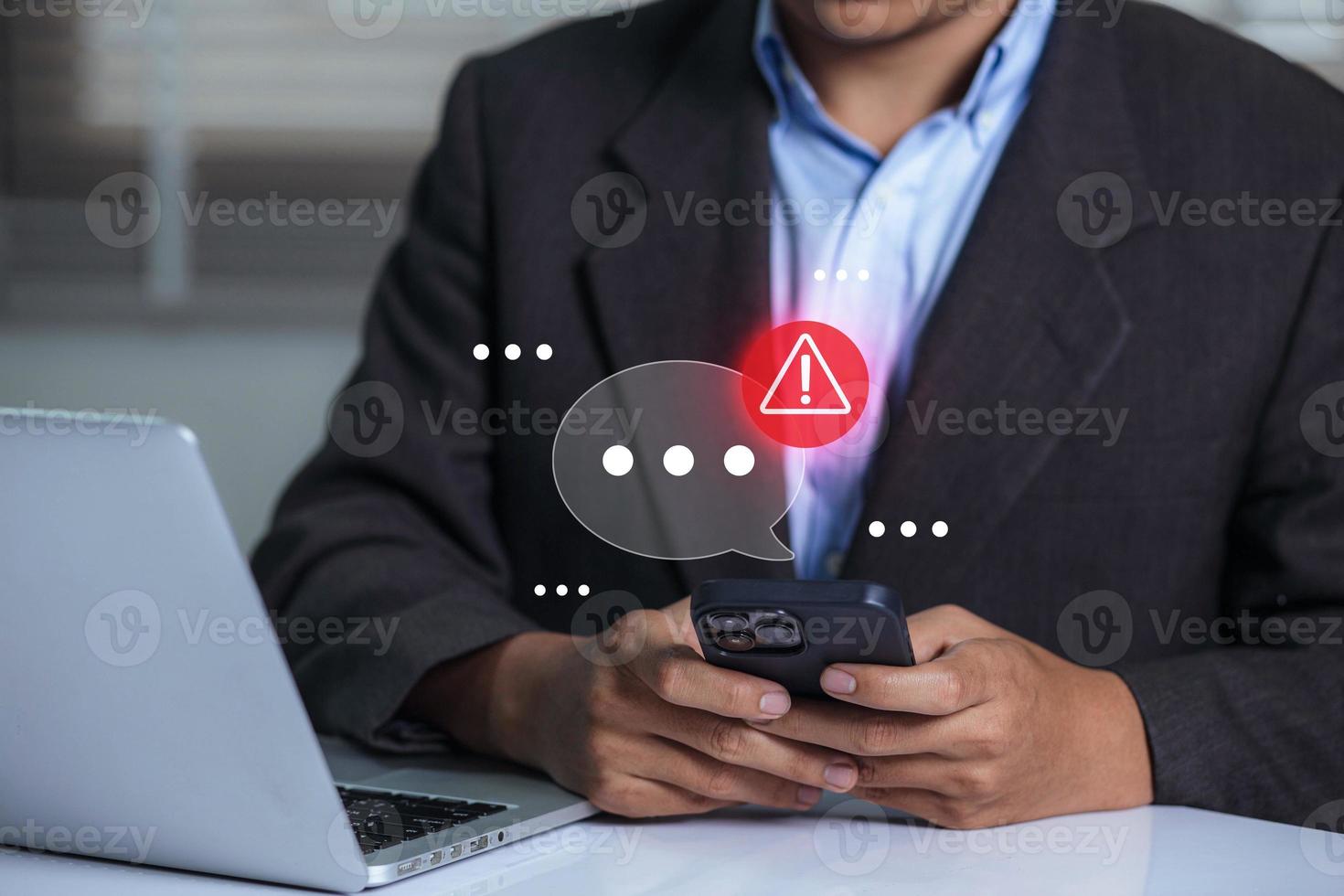 Businessman using smartphone with new message electronic email hacking and spam warning symbol. cyber attack network, virus, spyware, Cyber security and cybercrime. photo