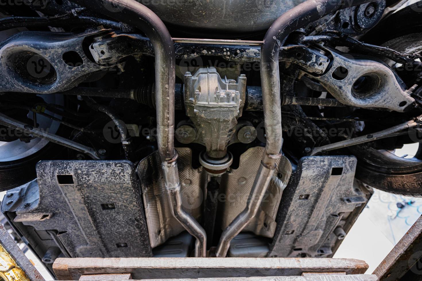 Service repair station working with muscle car.  Bottom view of pickup car photo