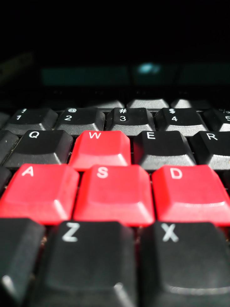 old mechanical keyboard with red buttion photo