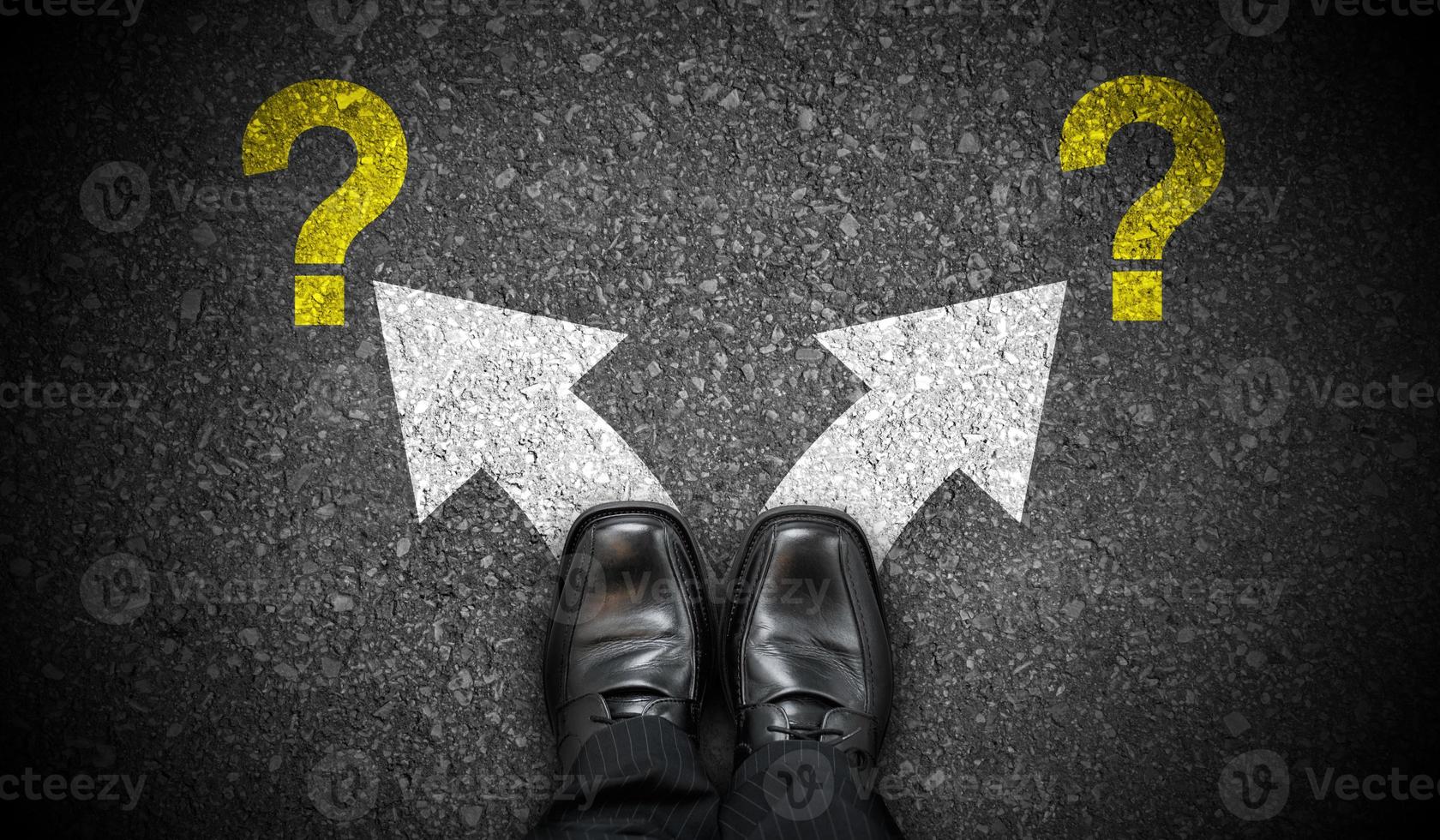 Black Business Shoes, Two Arrows and Question Marks - Problem Concept photo