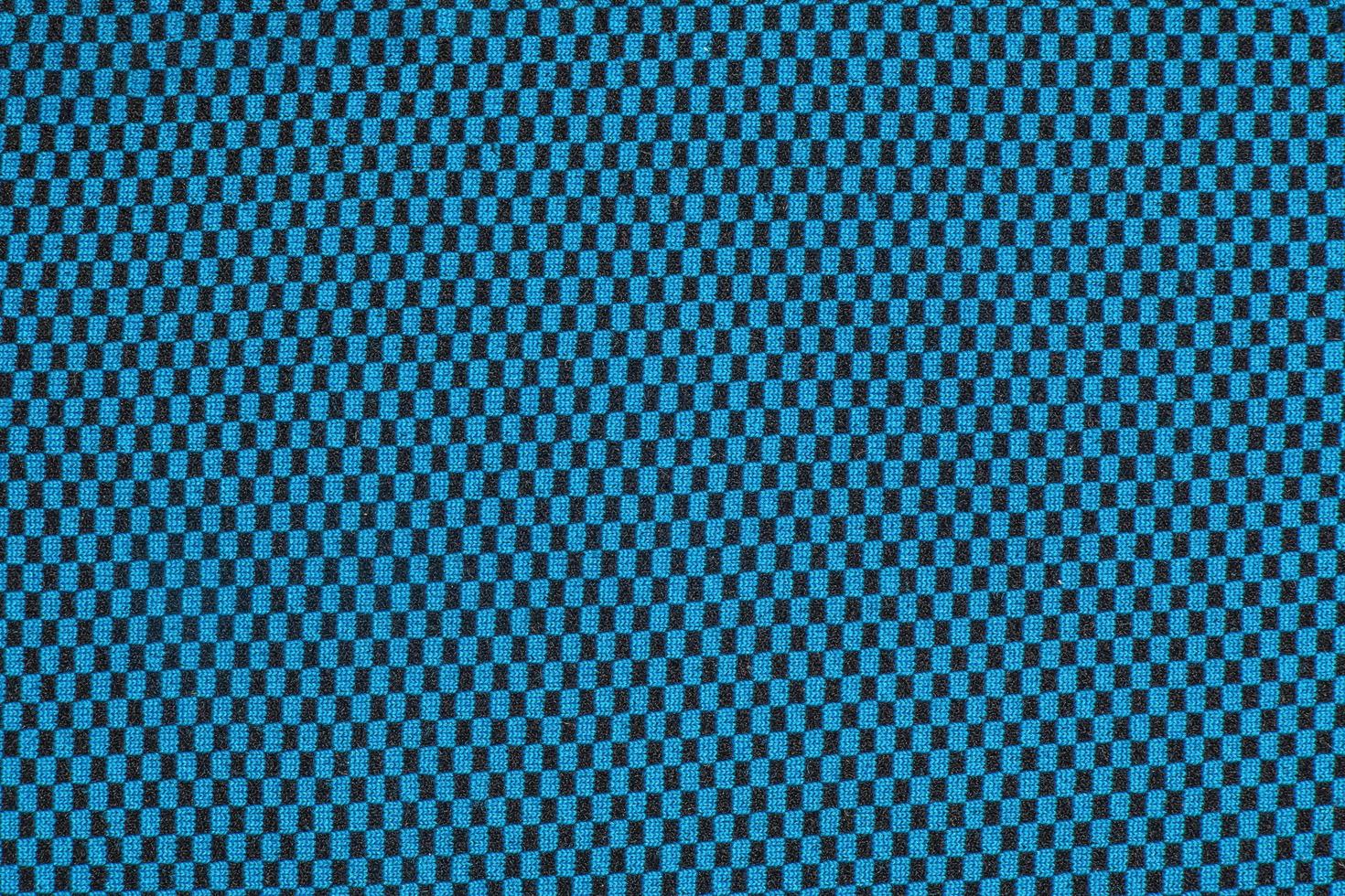 Synthetic fabric texture, blue plaid, beautiful background pattern. Fragment of thermal underwear fabric. photo