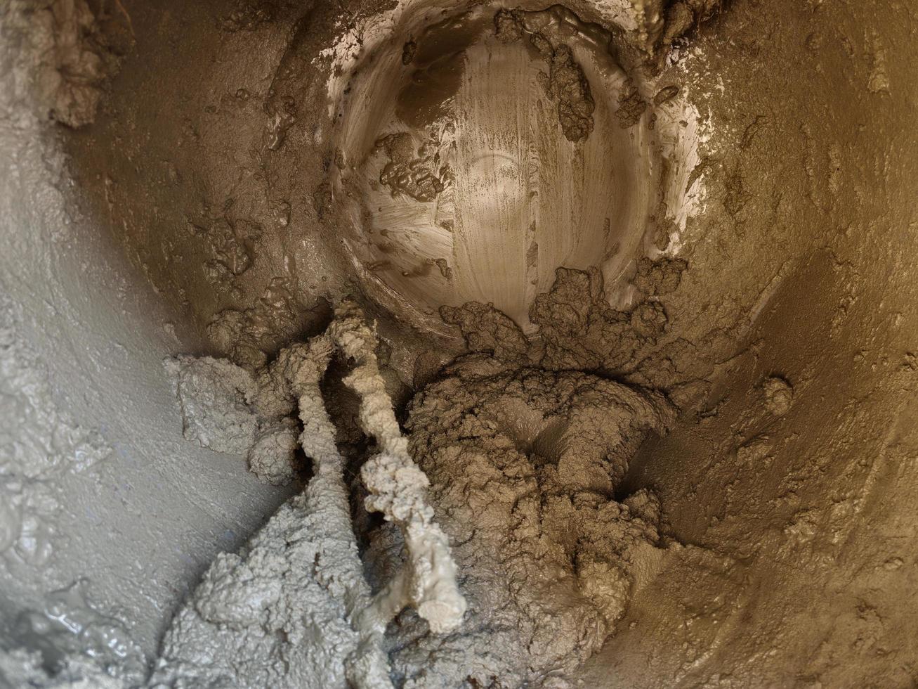 Internal mechanism with liquid concrete capacity of small concrete mixer. photo