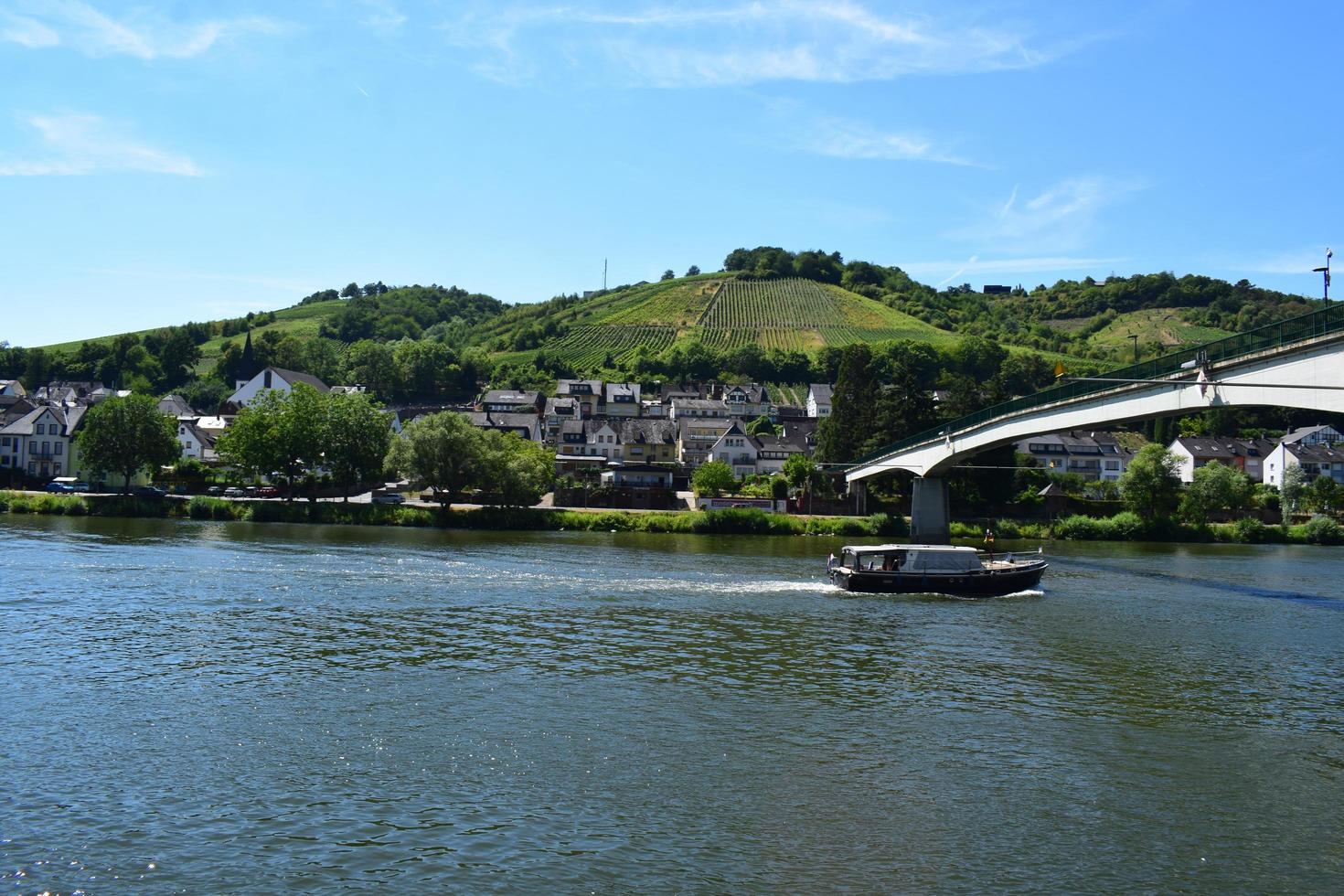 Zell an der Mosel, Germany, 2022 - ship under a bridge in Zell an der Mosel photo