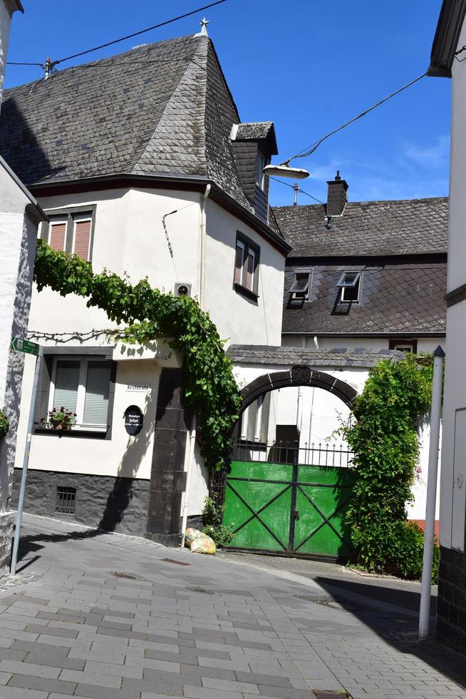 Winningen, Germany, 2022 - Winery gate with vine growing around photo