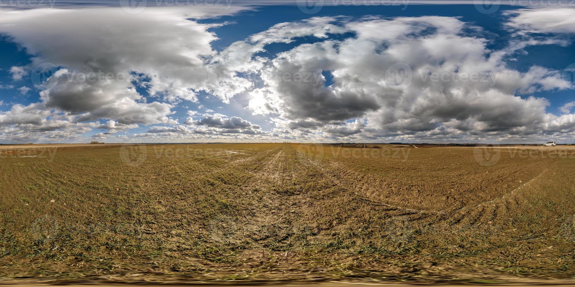 spherical 360 hdri panorama among farming field with clouds on blue sky in equirectangular seamless projection, use as sky replacement in drone panoramas, game development as sky dome or VR content photo