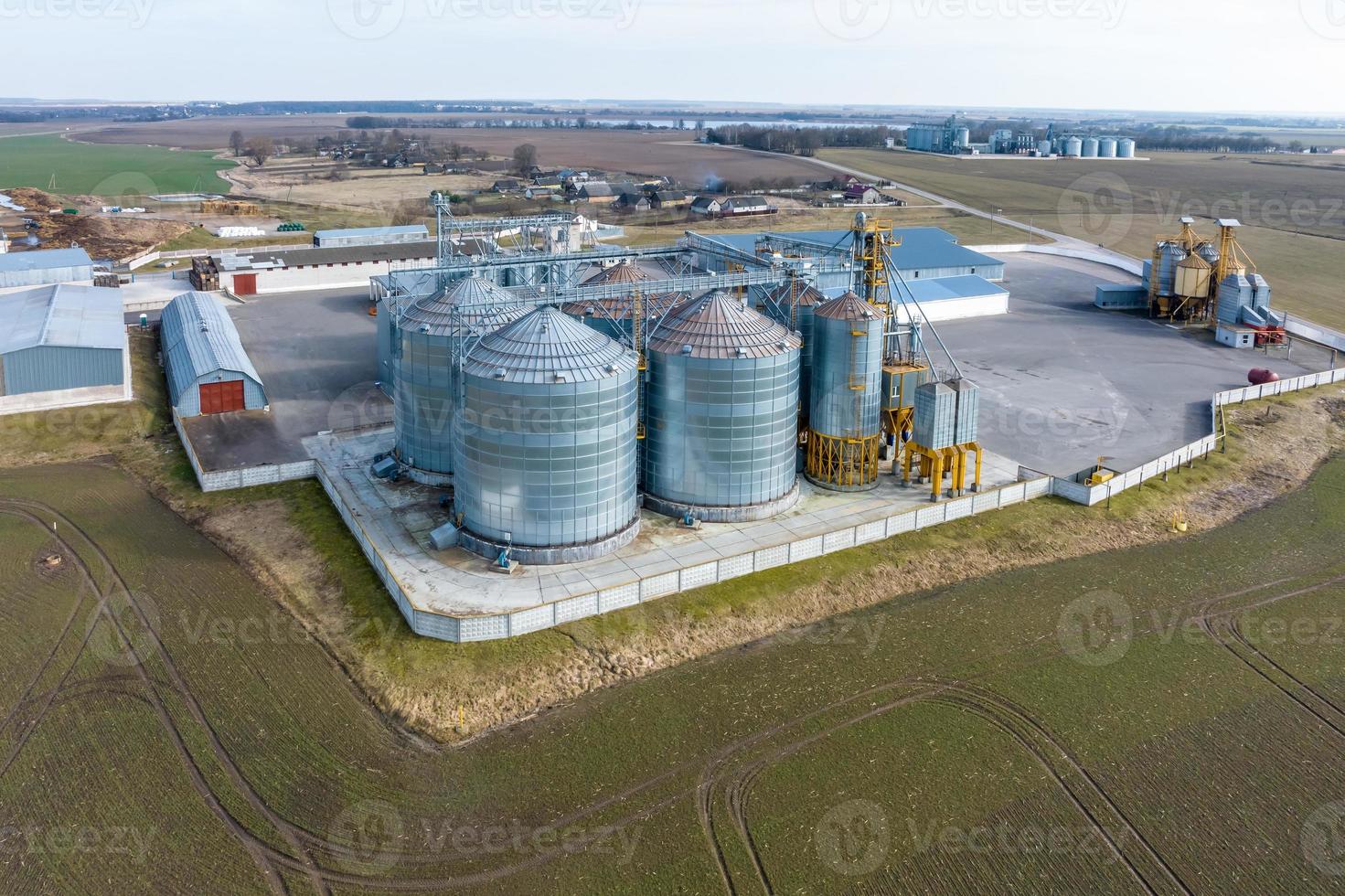 aerial view of agro-industrial complex with silos and grain drying line photo