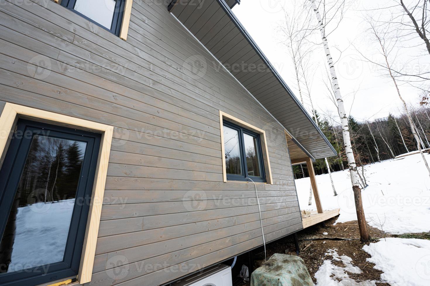 Alone wooden country house in snowy mountains. Soul weekends. Life without neighbors. photo