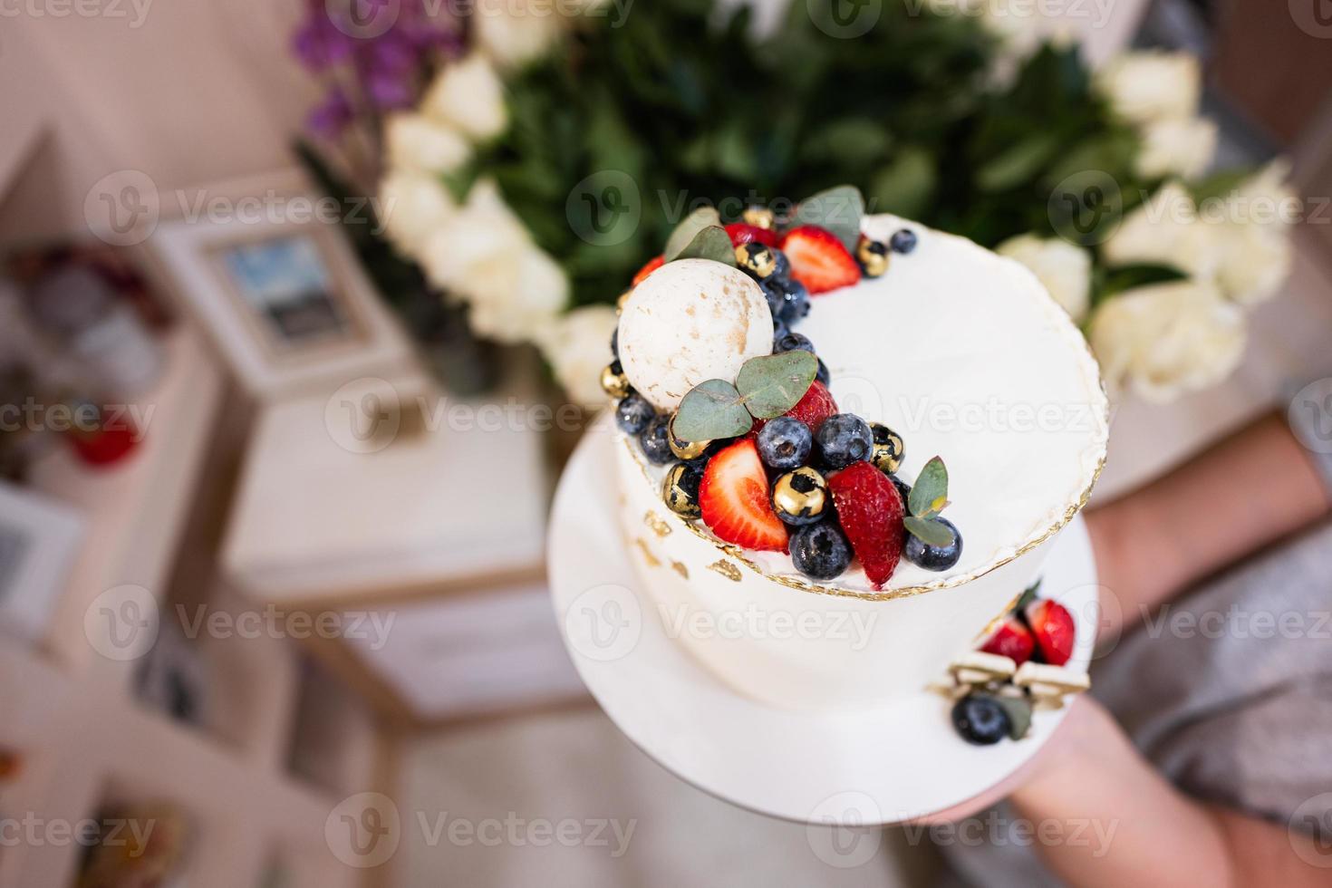 Happy birthday to you. Cake with fruits, blueberries and strawberries. photo