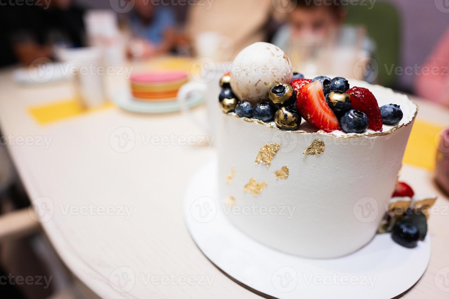 Happy birthday to you. Cake with fruits, blueberries and strawberries. photo