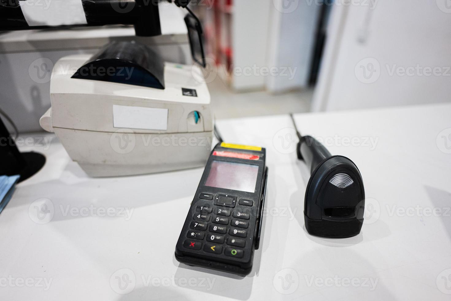 Payment pos terminal on a store counter. photo