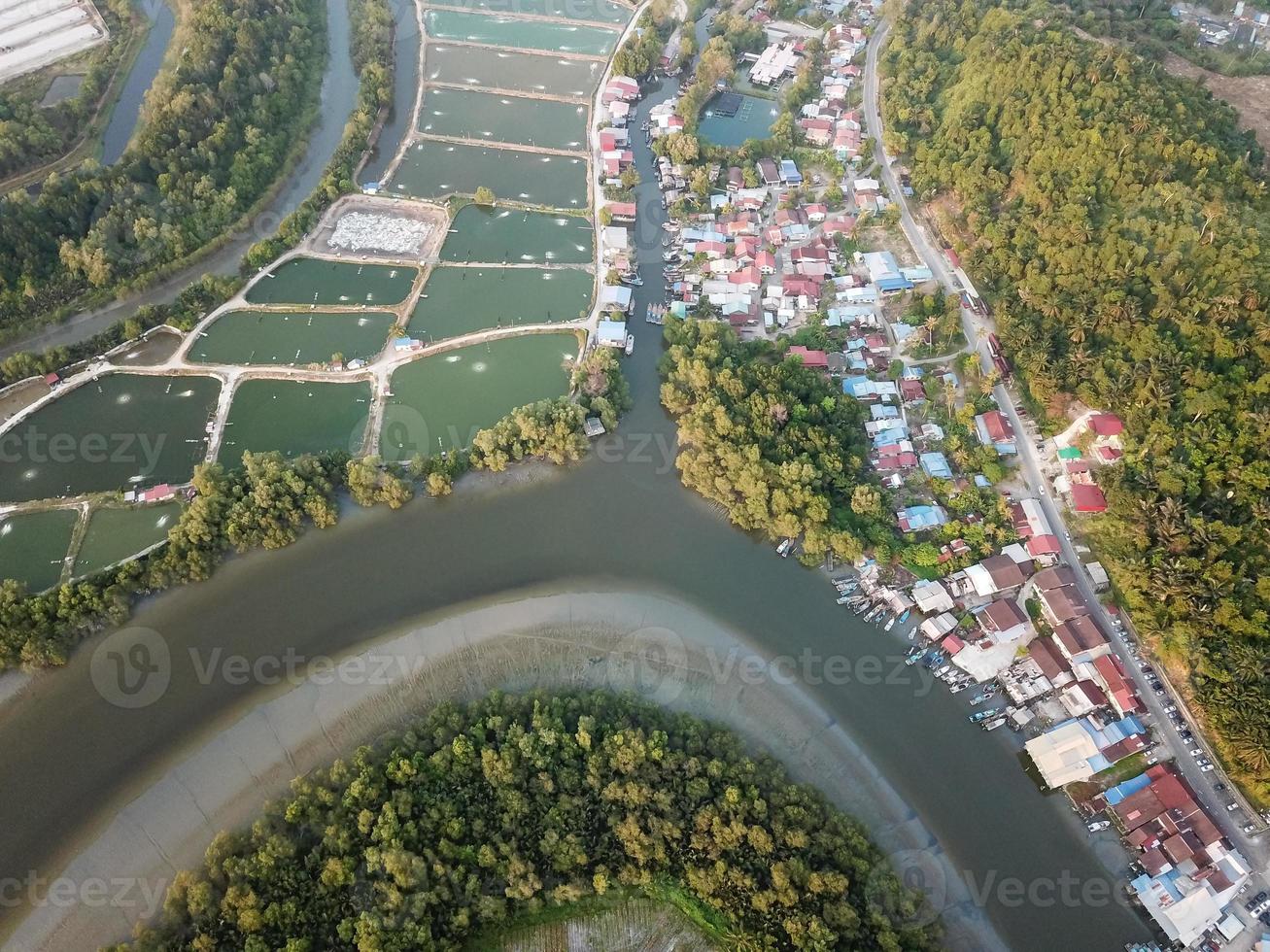 Aerial view fishing village and fish farm photo