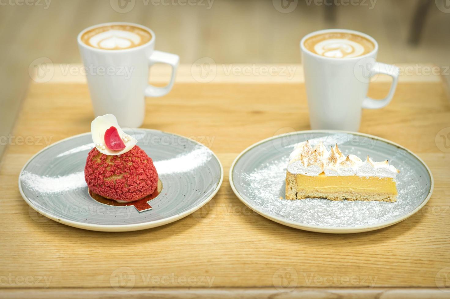 Cups of coffee with pieces of cakes photo