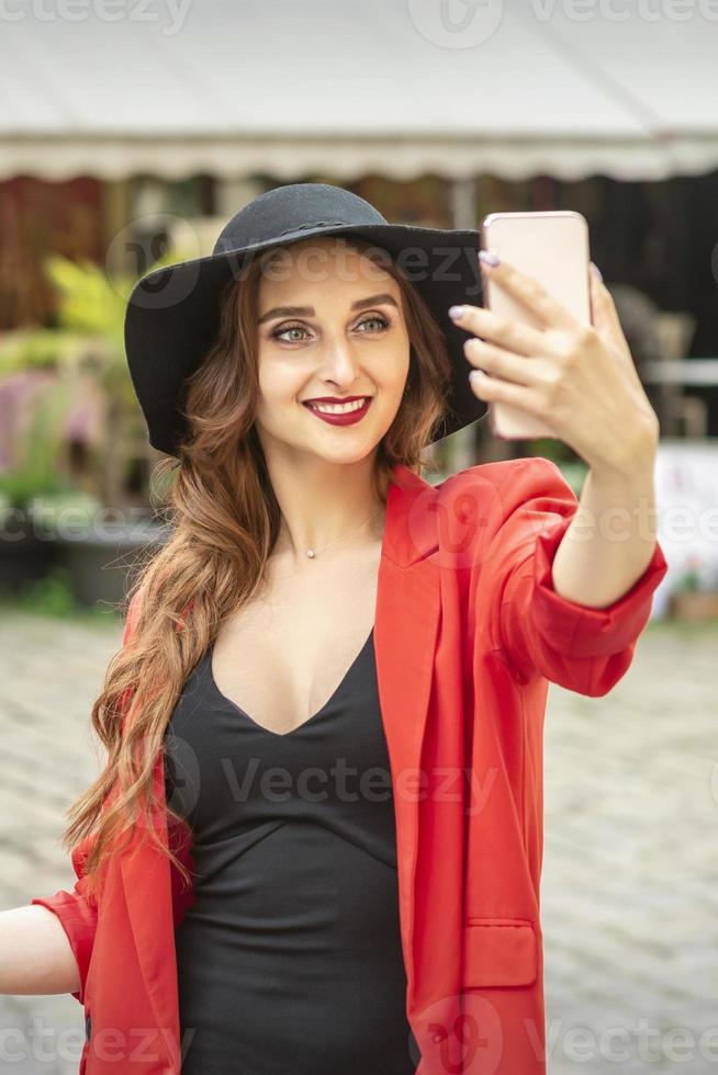 Tourist woman takes a selfie photo
