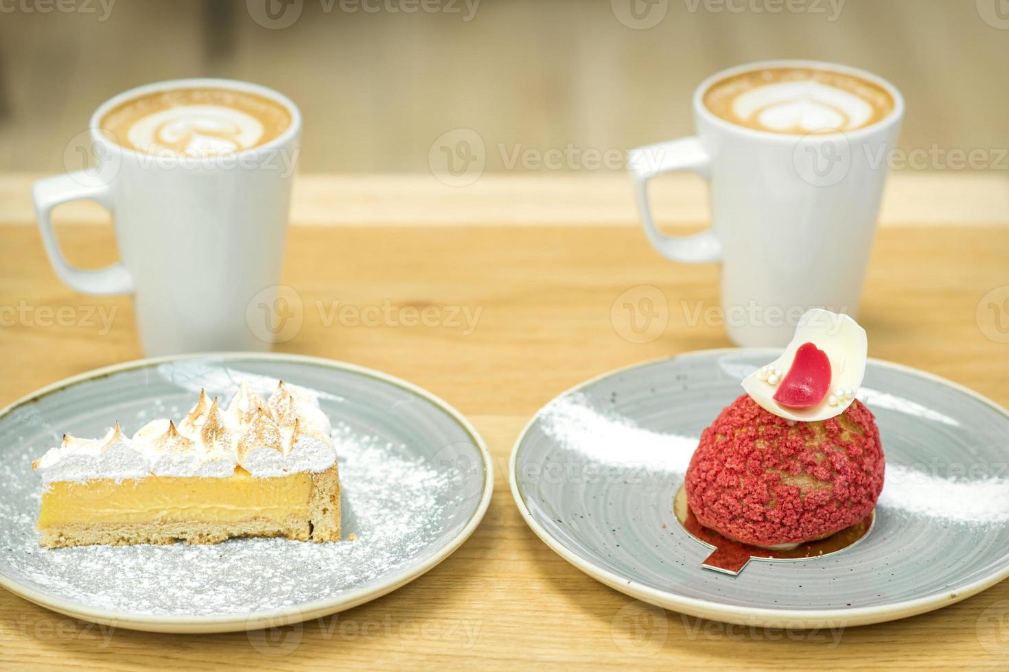 Cups of coffee with pieces of cakes photo
