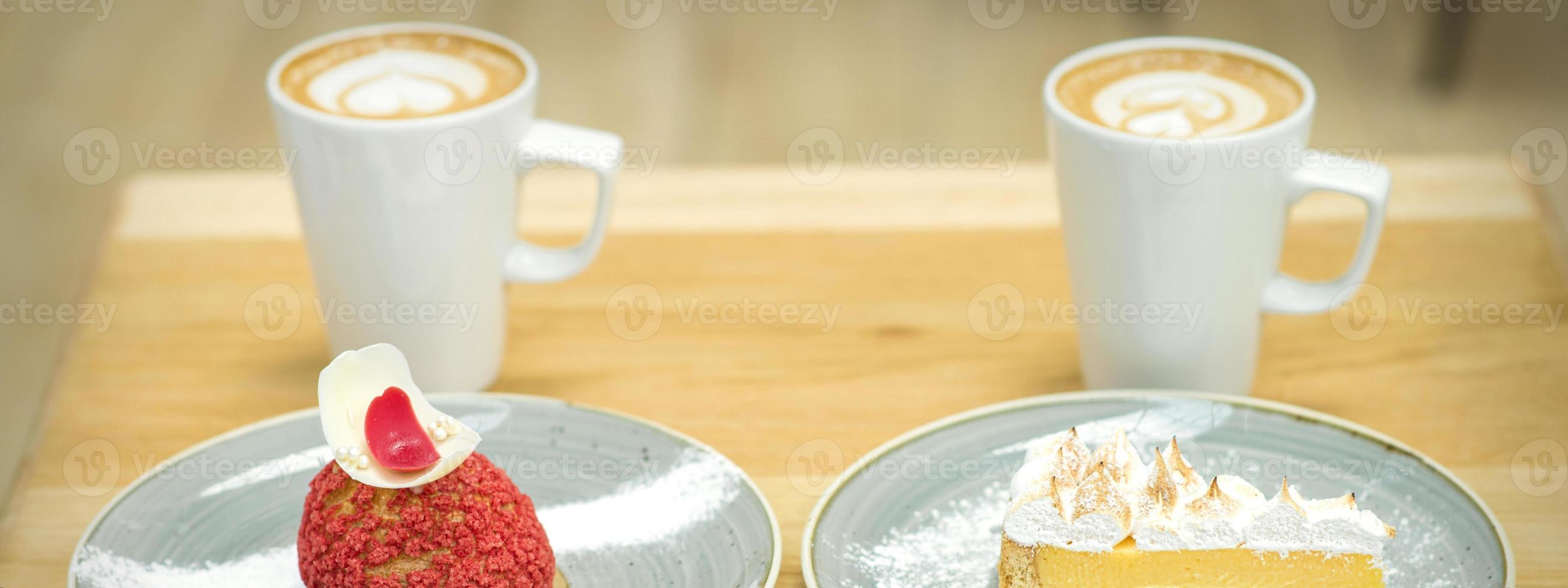 Cups of coffee with pieces of cakes photo
