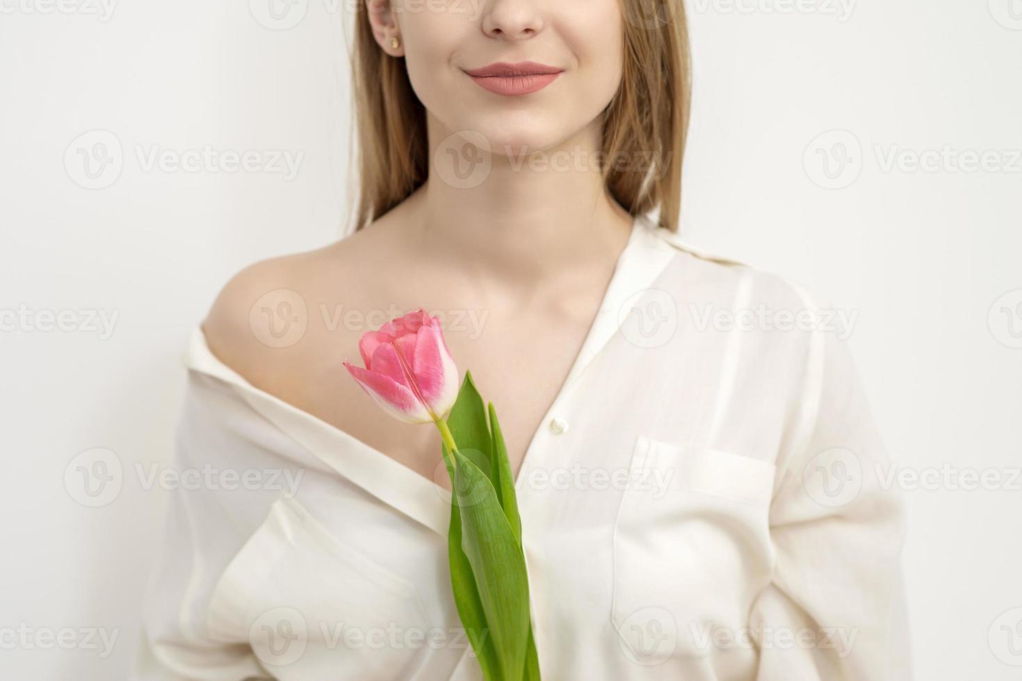 Young woman with one tulip photo