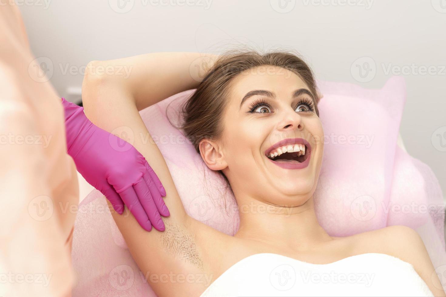 Young woman during armpit examination photo
