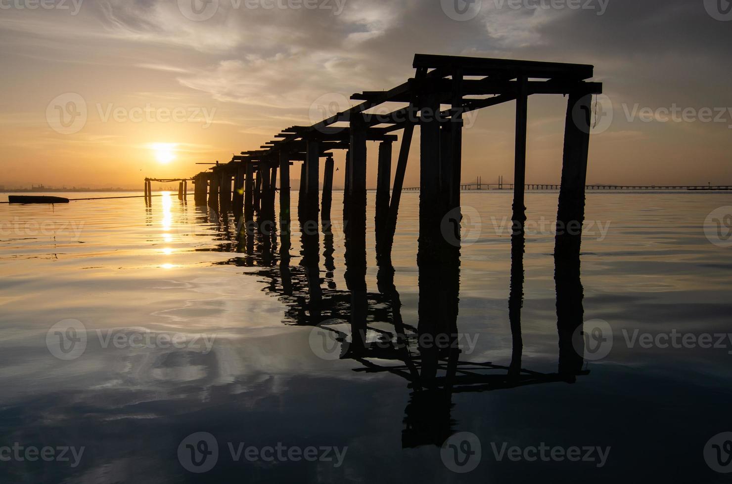 Broken bridge in morning with dramatic sunrise at Jelutong, Penang photo