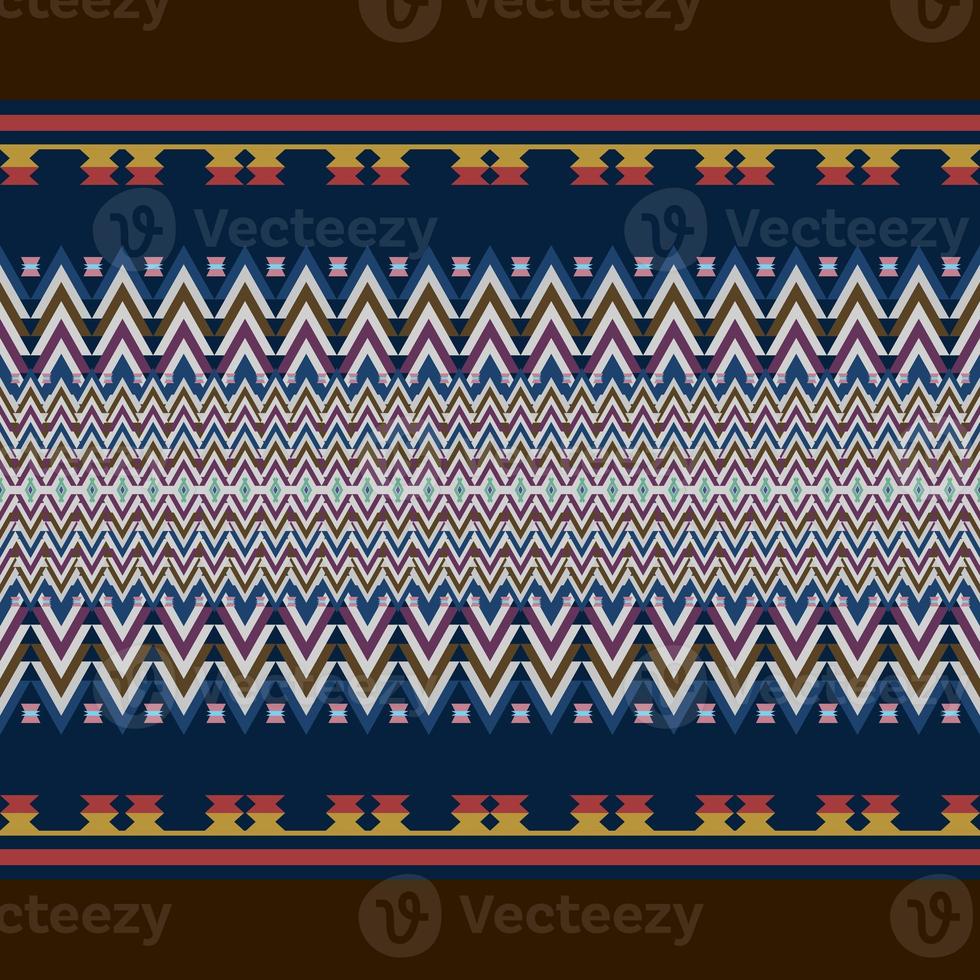 Ikat geometric folklore ornament. Tribal ethnic texture. Seamless striped pattern in Aztec style. Figure tribal embroidery. Indian, Scandinavian, Gyp sy, Mexican, folk pattern. Seamless pattern fab photo