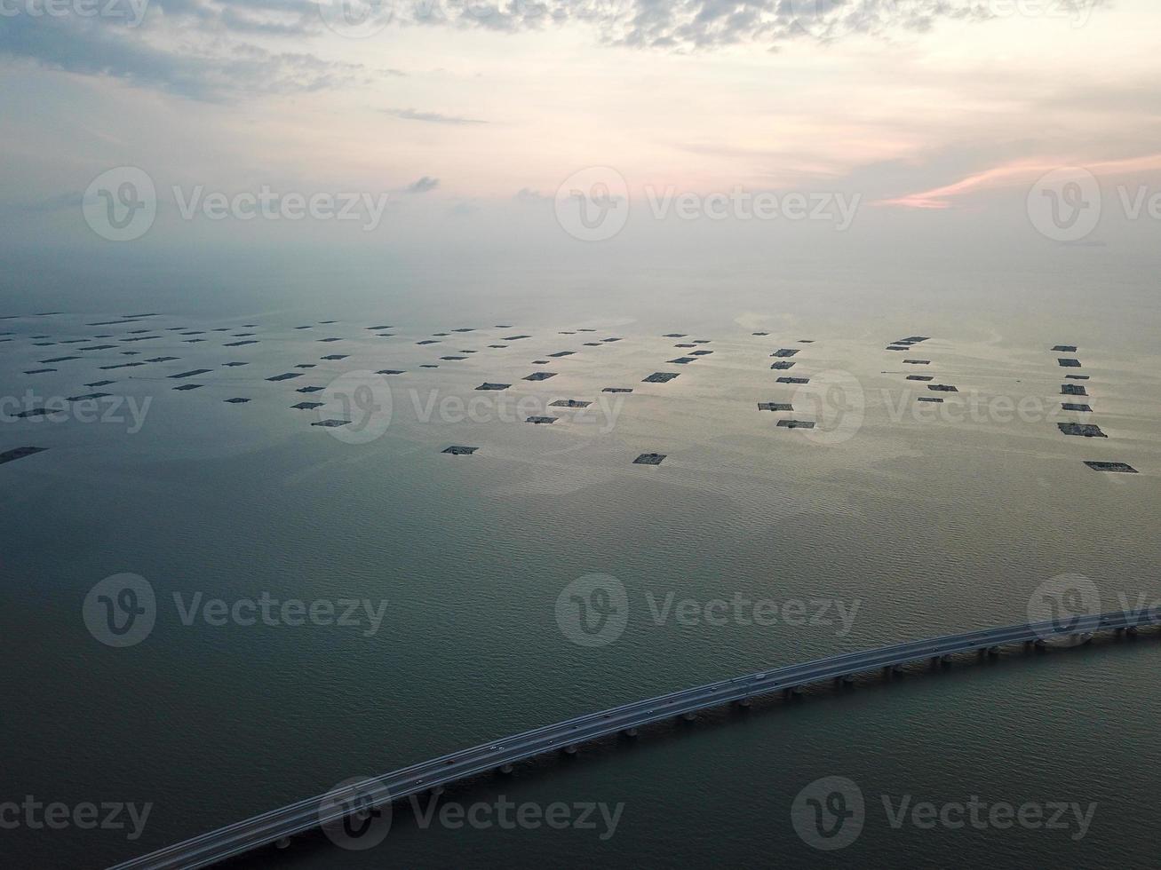 Penang second Bridge with fish farm at background photo