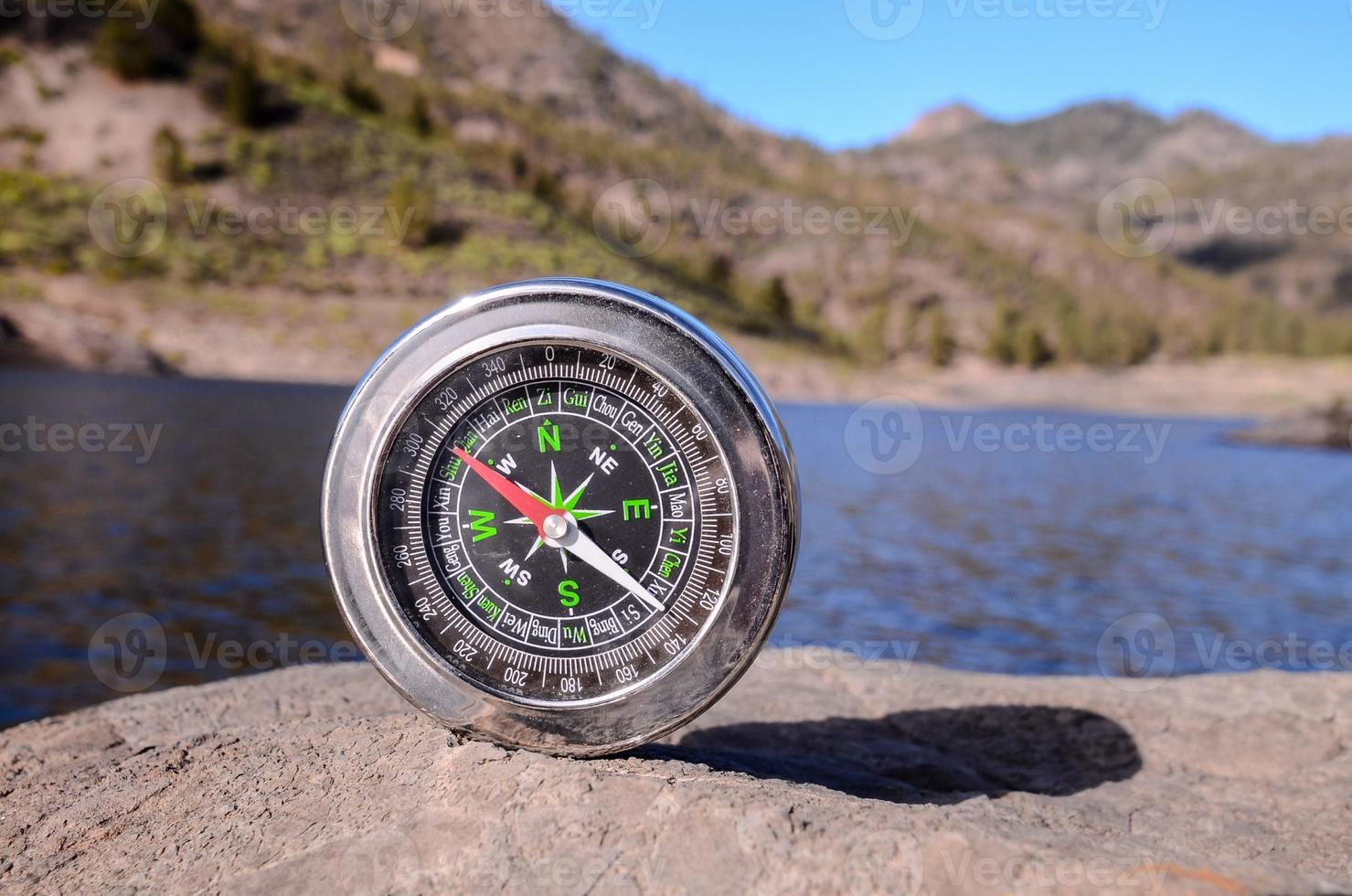 Compass on the rock photo