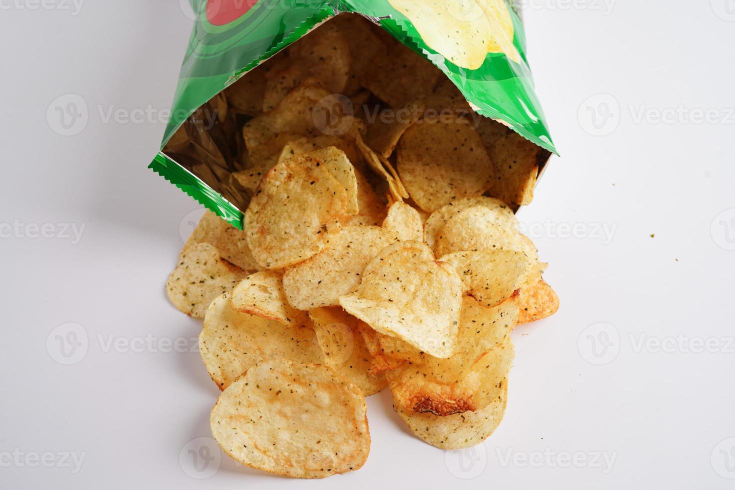 Potato chips in open bag, delicious BBQ seasoning spicy for crips, thin slice deep fried snack fast food in open bag. photo