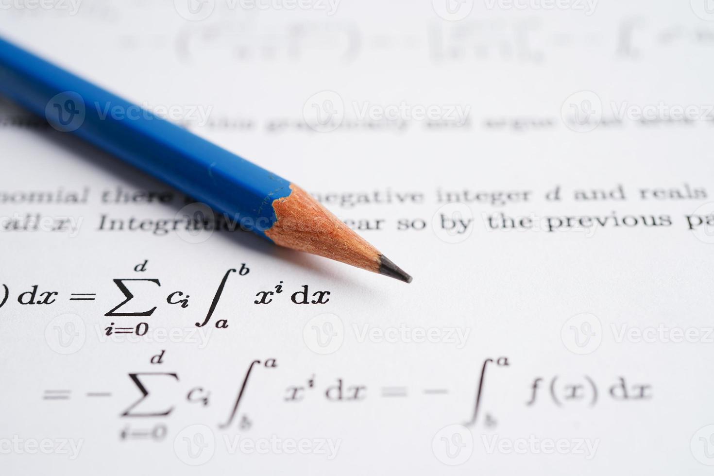 Pencil on mathematic formula exercise test paper in education school. photo