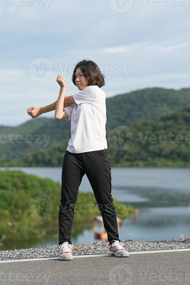 Woman short hair doing exercising outdoor photo