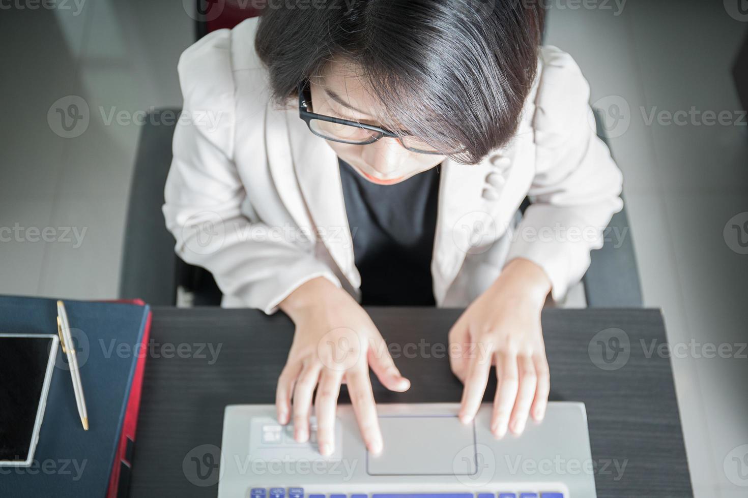 Young woman working on laptop photo