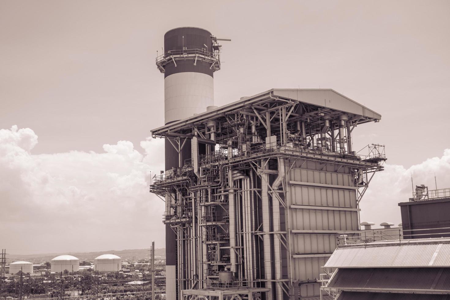 combine cycle project power plant when day time with sky and cloudy vibes.  The photo is suitable to use for industry background photography, power plant poster and electricity content media.