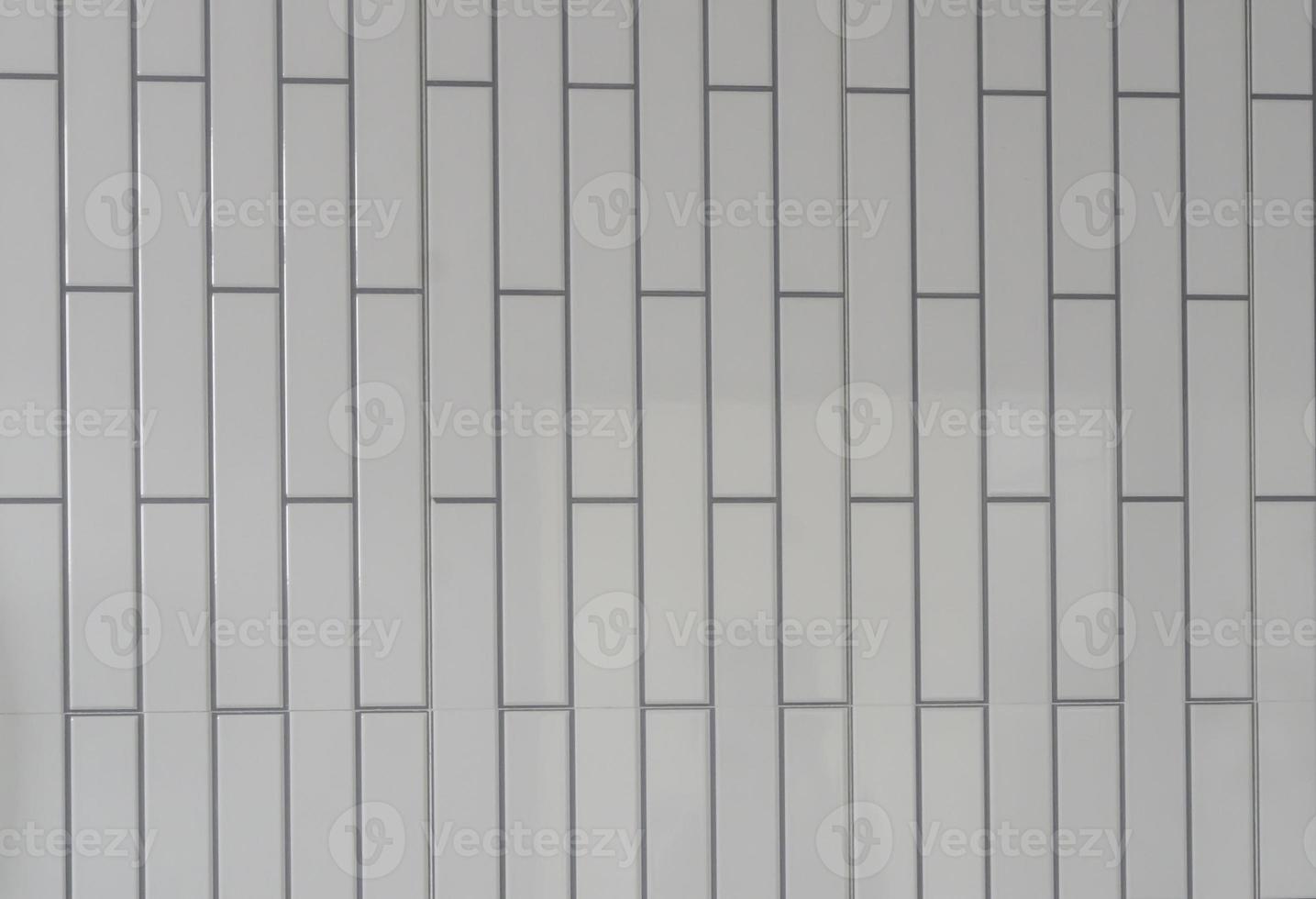 Small white tiled wall with vertical pattern used for background or texture in decorative art work or template photo