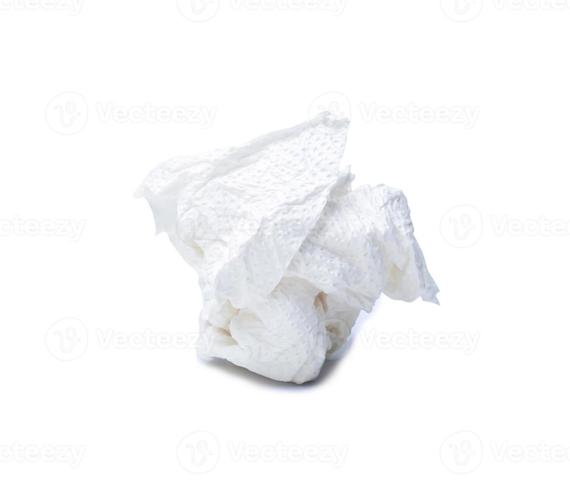 Single screwed or crumpled tissue paper or napkin in ball shape after use isolated on white background with clipping path photo