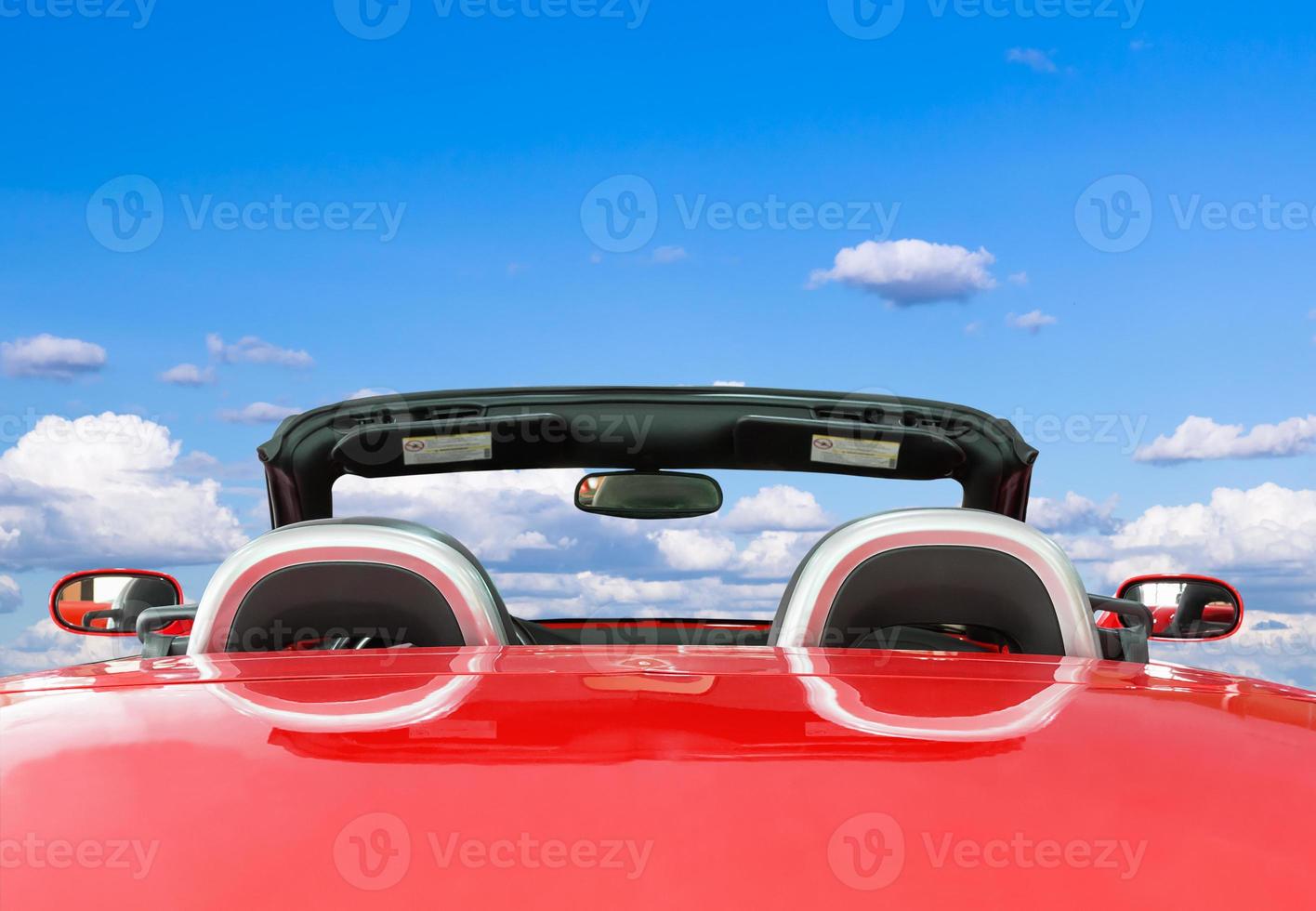 Red car with blue sky background photo